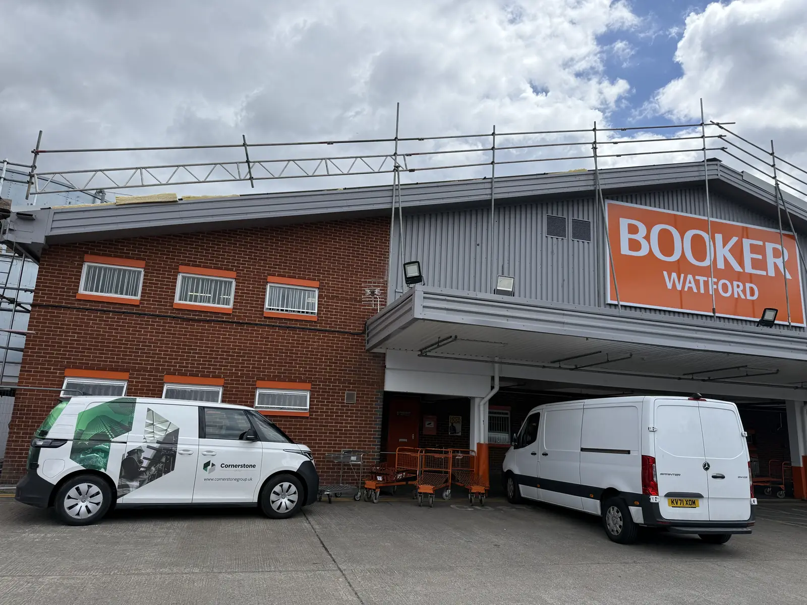 Cornerstone van parked at Booker Watford with edge protection scaffold to the roof