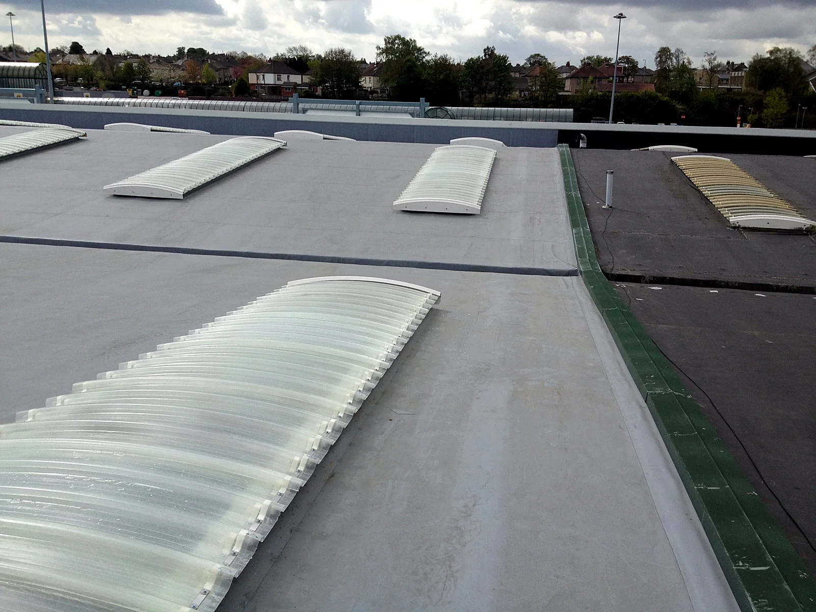 Replacement rooflights fitted into a single-ply roof