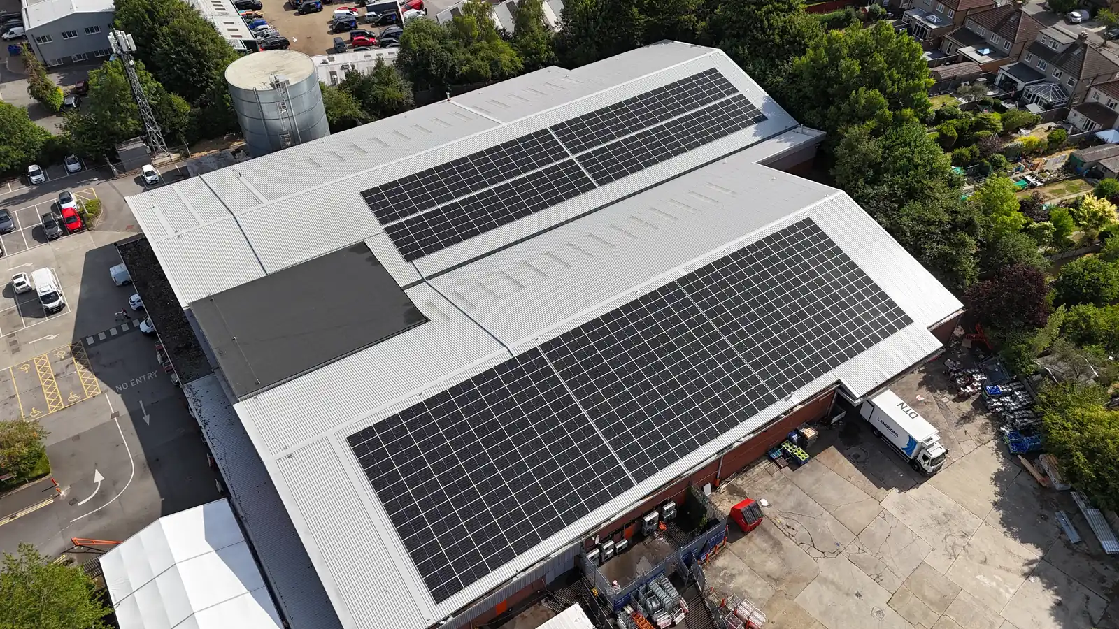 Two large solar arrays running along the re-roofed Booker Watford warehouse