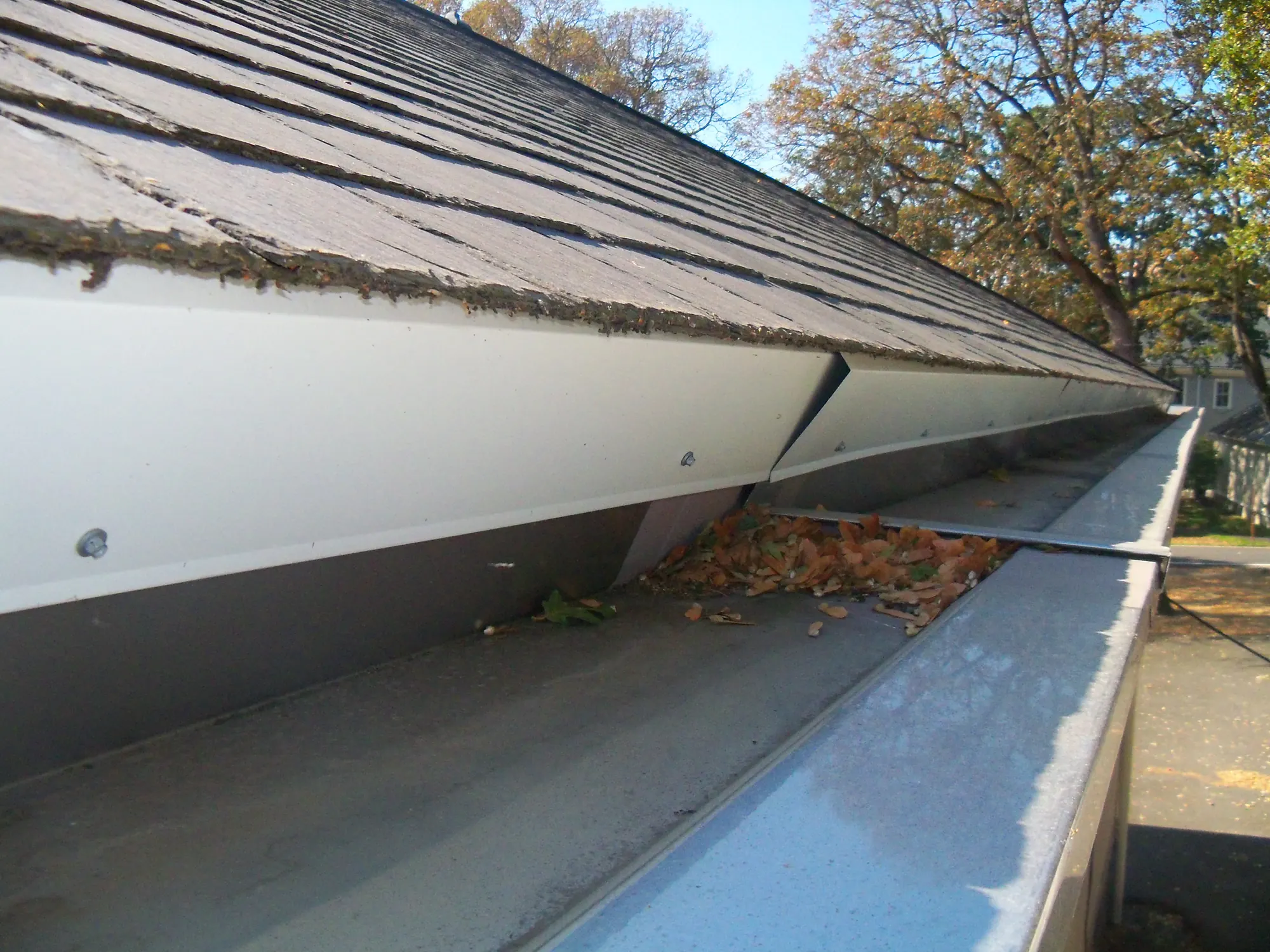 Repaired gutter and roof edge after planned roof maintenance