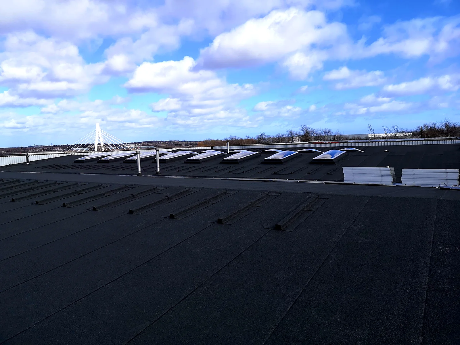 Finished felt roof with rooflights on an industrial unit
