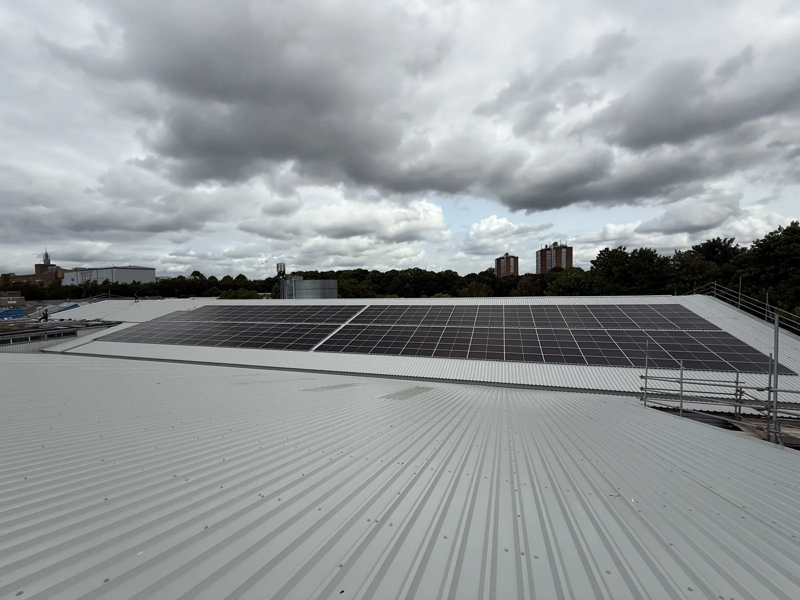 New profiled metal roof sheets with the first solar array beyond
