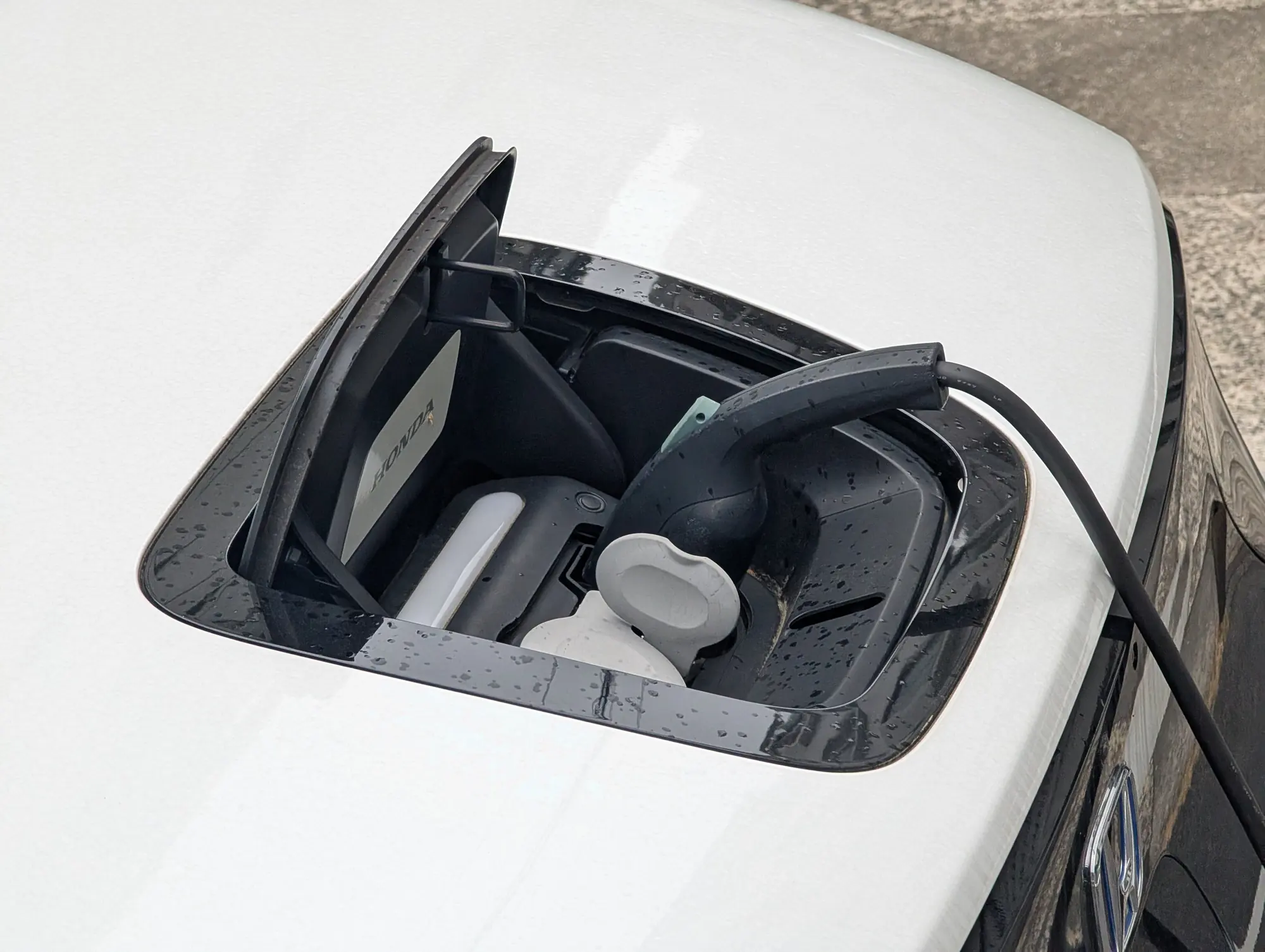 Charging cable plugged into an electric vehicle