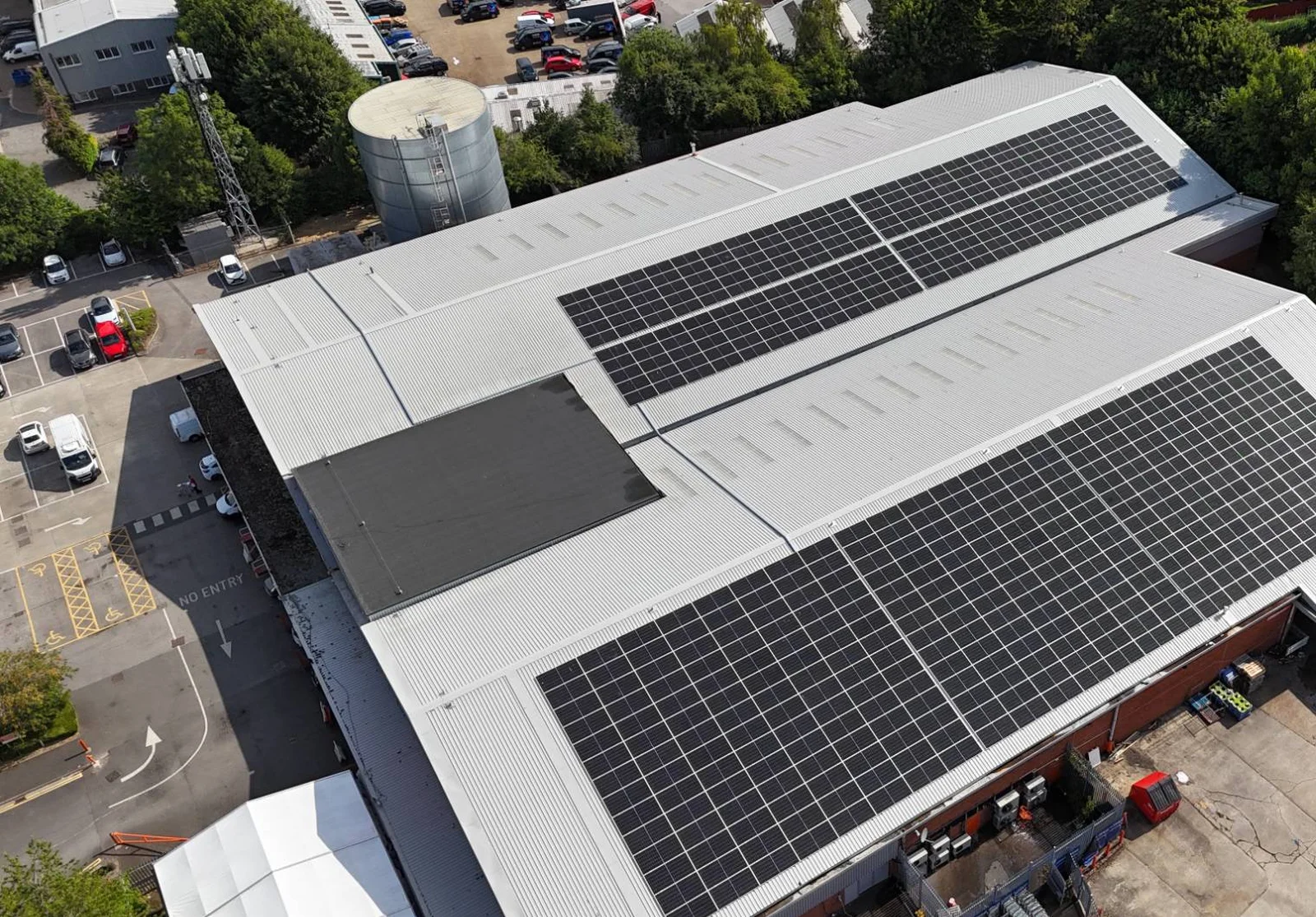 Aerial view of the large rooftop solar arrays on the re-roofed Booker Watford warehouse