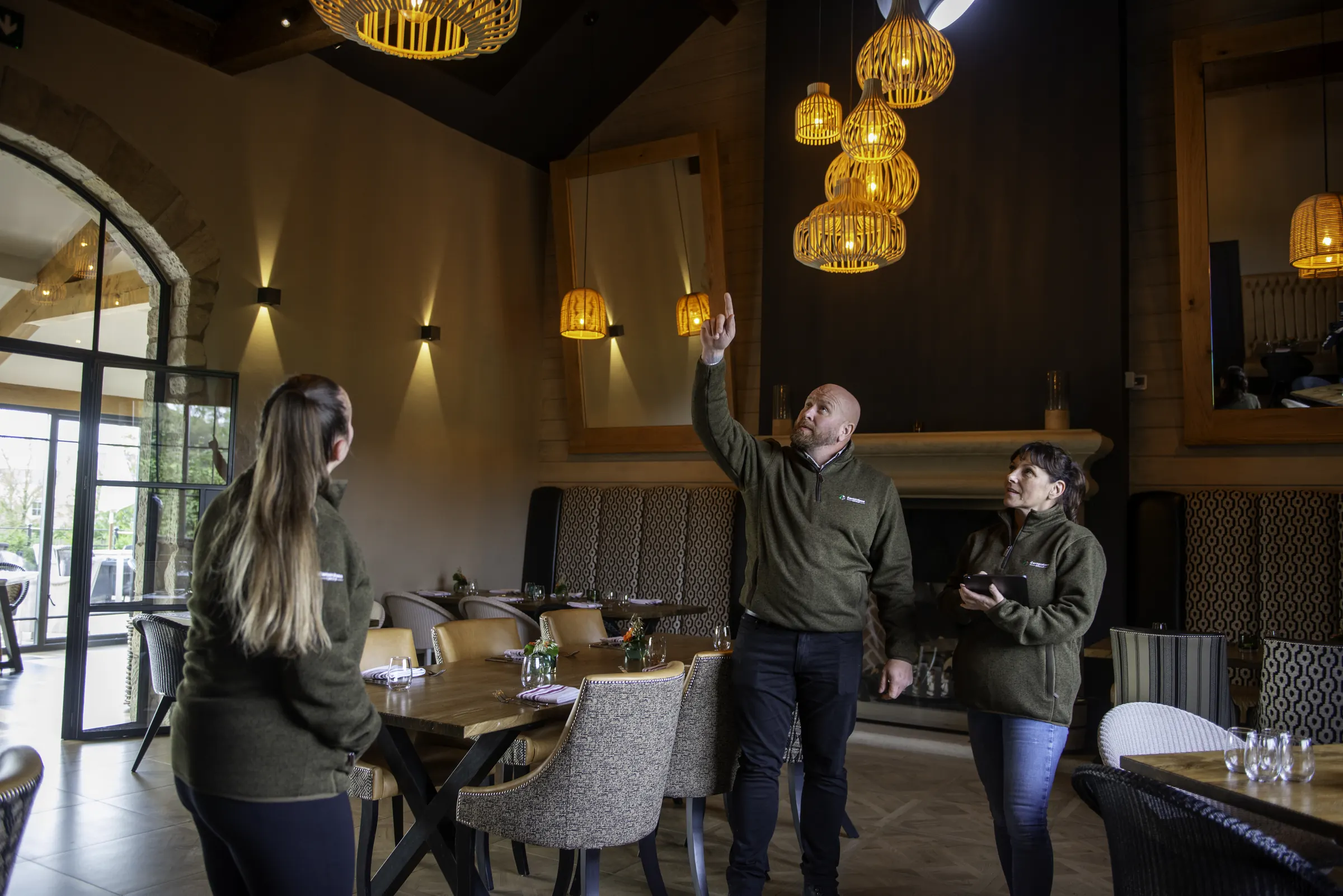 The Cornerstone team reviewing the restored dining room at Ye Horns Inn