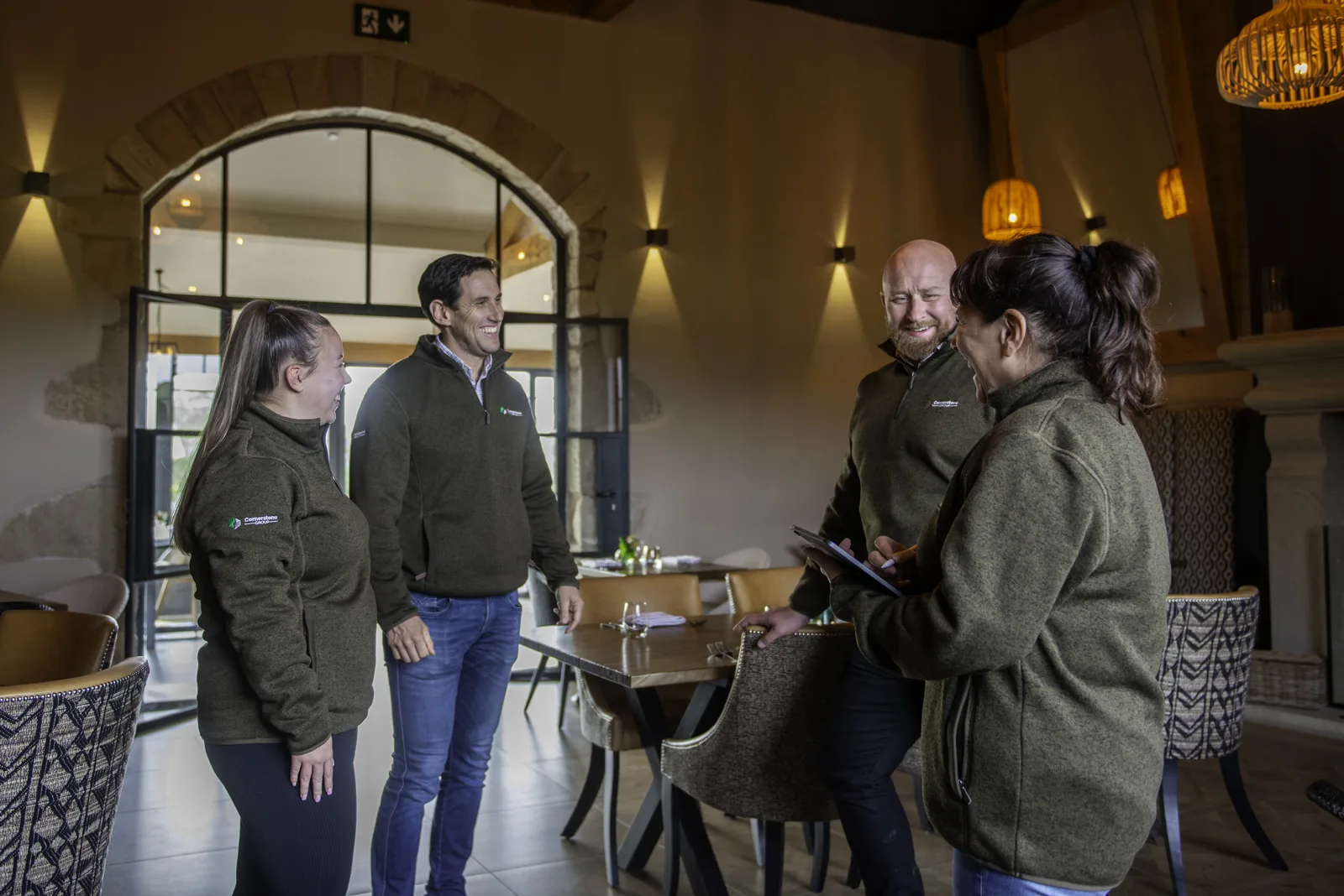 Cornerstone team walking through the dining room before handover