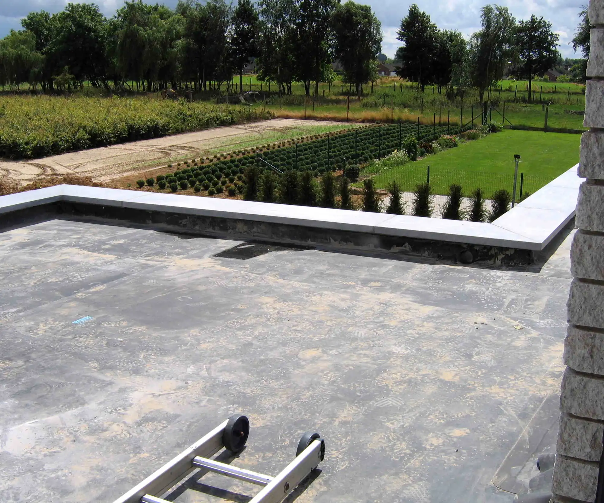 Newly finished flat roof with a clean, well-laid waterproof membrane and neat upstands